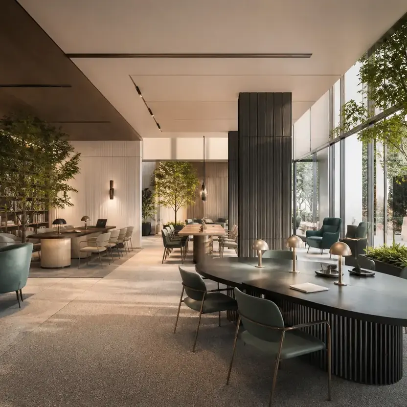 A work lounge with a long table and library shelves